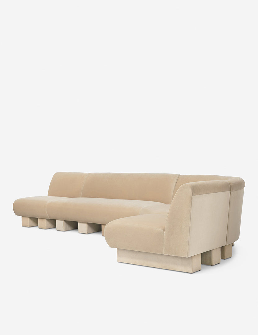 #color::brie-classic-velvet #configuration::right-facing #size::142-W | Angled view of the Lena right-facing beige velvet sectional sofa with upholstered beam legs 