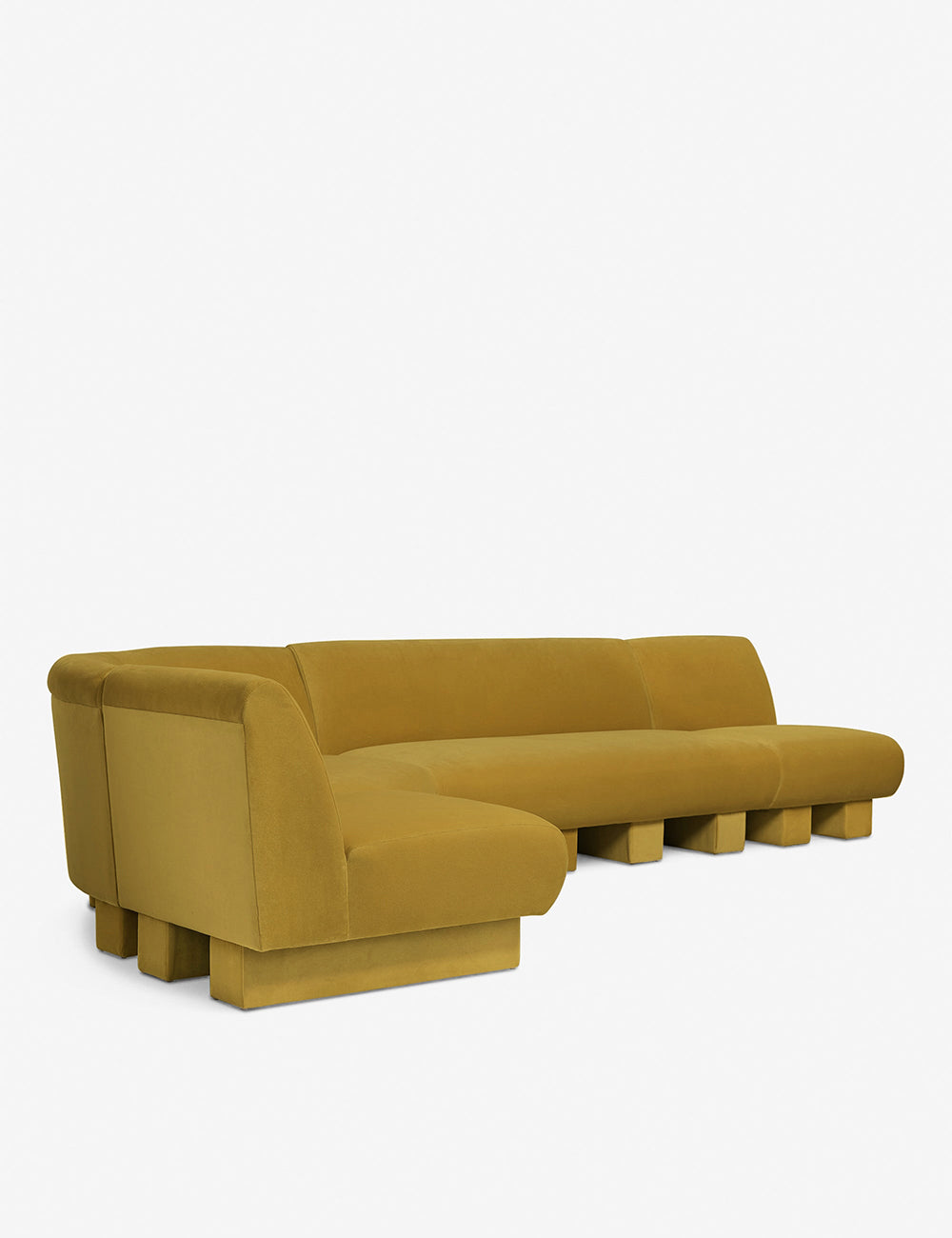 Angled view of the Lena left-facing yellow velvet sectional sofa with upholstered beam legs.