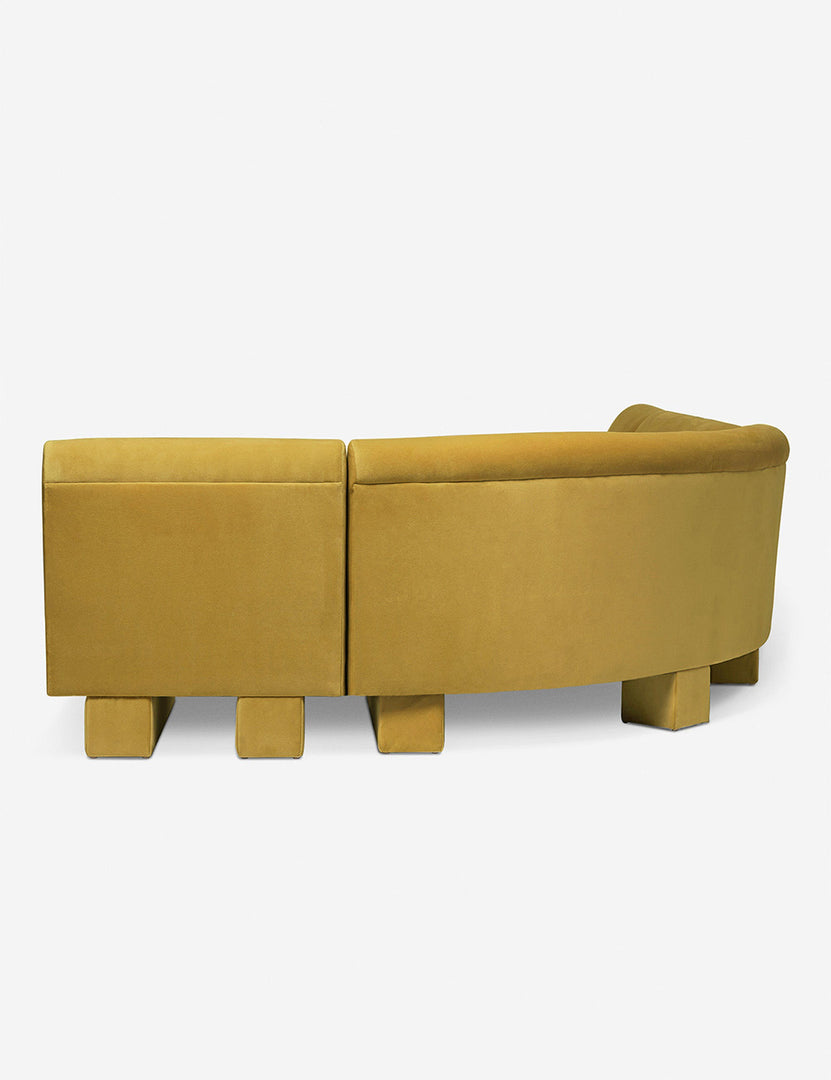 #color::goldenrod-plush-velvet #configuration::left-facing #size::142-W | Rear view of the side of the Lena left-facing yellow velvet sectional sofa with upholstered beam legs.