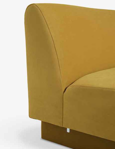 #color::goldenrod-plush-velvet #configuration::left-facing #configuration::right-facing #size::142-W #size::114-W | Side view of the Centerpiece of the Lena yellow velvet sectional sofa with upholstered beam legs