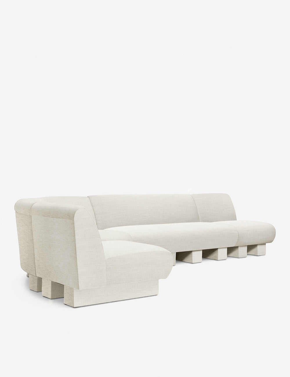 Angled view of the Lena left-facing natural linen sectional sofa with upholstered beam legs.