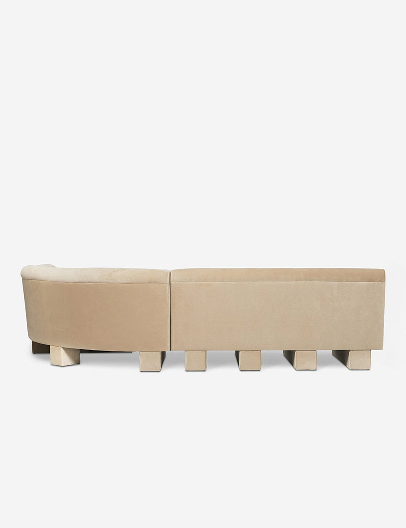 #color::brie-classic-Velvet #configuration::right-facing #size::114-W | Rear view of the entire Lena left-facing beige velvet sectional sofa with upholstered beam legs.