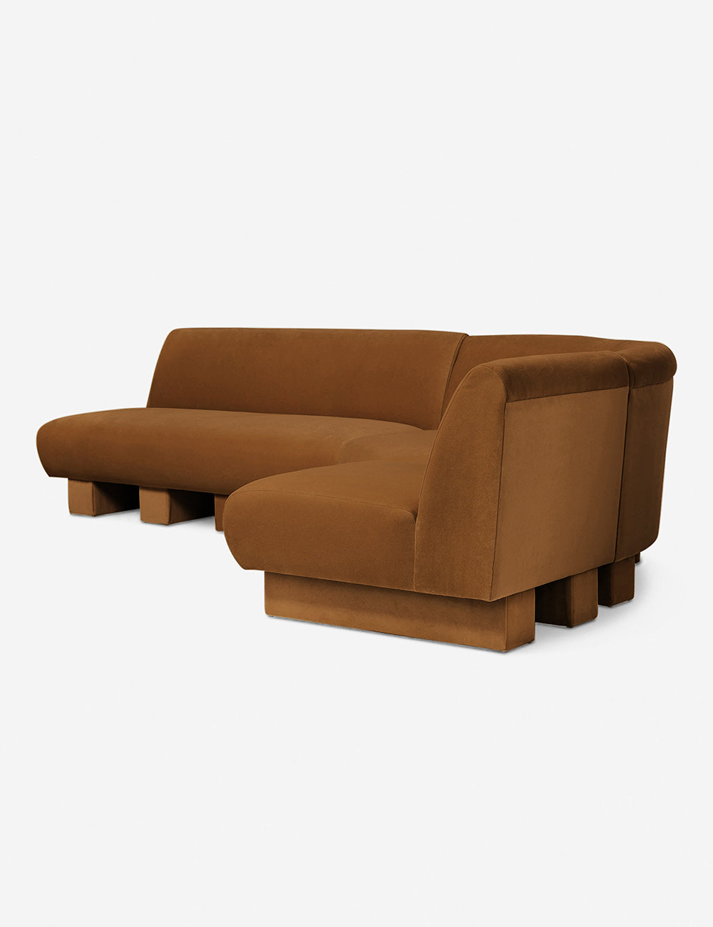 Angled view of the Lena left-facing cognac velvet sectional sofa with upholstered beam legs.