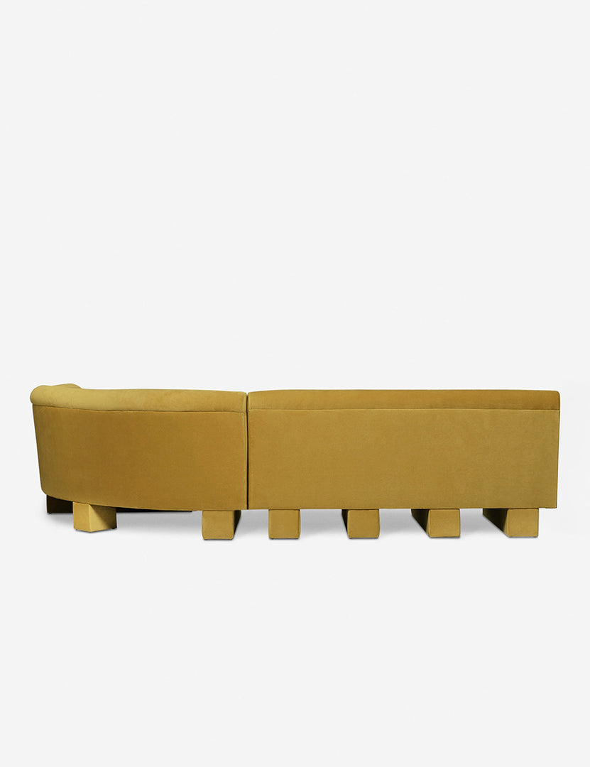 #color::goldenrod-plush-velvet #configuration::right-facing #size::114-W | Rear view of the entire Lena right-facing yellow velvet sectional sofa with upholstered beam legs.