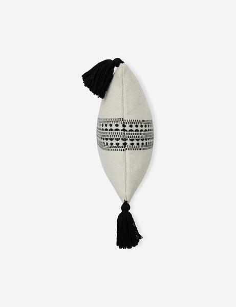 #color::natural-and-black #style::lumbar | Side view of the Marchesa natural and black indoor and outdoor pillow with tasseled corners
