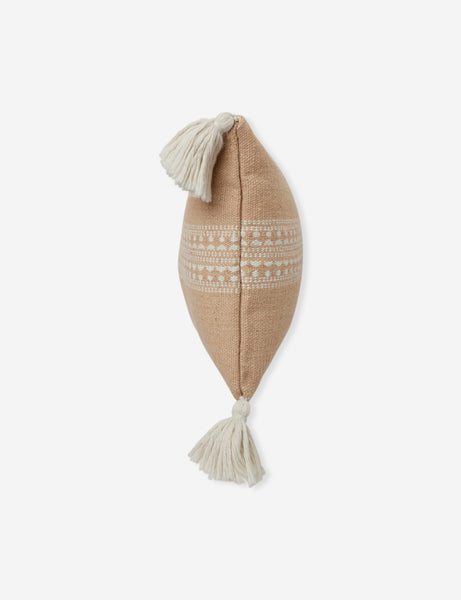 #color::sandstone #style::lumbar | Side view of the Marchesa sandstone indoor and outdoor lumbar pillow with tasseled corners