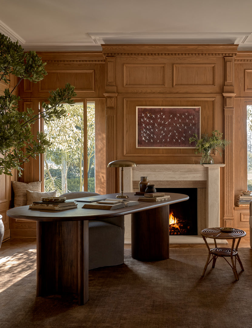 #color::copper #size::6--x-9- #size::8--x-10- #size::9--x-12- #size::10--x-14- #size::12--x-15- #size::6--round #size::8--round | The Chiltern copper rug lays in an office space with wooden accented walls under a dark wooden desk