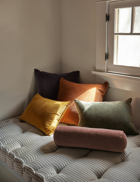 #color::mustard #style::lumbar  #fill type::with-feather-down-insert  #fill type::pillow-cover-only |   Charlotte velvet pillow in mustard, burnt orange, warm gray, and moss sit together on a striped cushioned bench