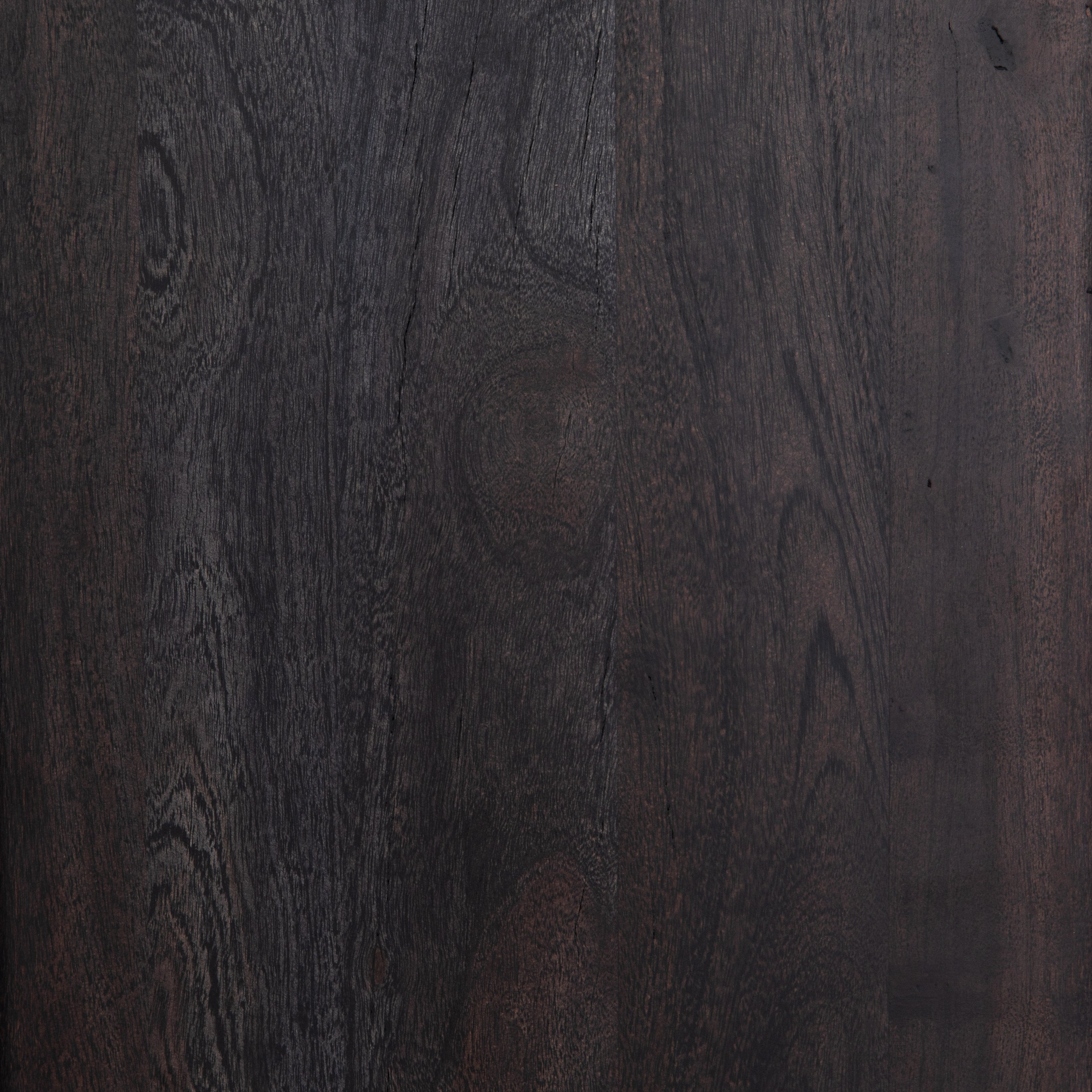Detailed view of the black mango wood on the Hannah black mango wood cabinet with cane doors