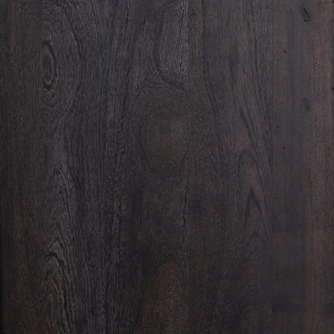 #color::black-and-natural | Detailed view of the black mango wood on the Hannah black mango wood cabinet with cane doors