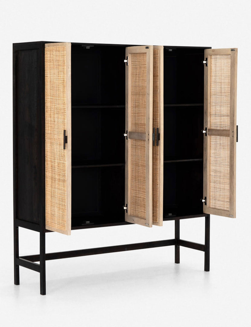 #color::black-and-natural | Angled view of the Hannah black mango wood cabinet with cane doors with all four doors open revealing the inner shelving