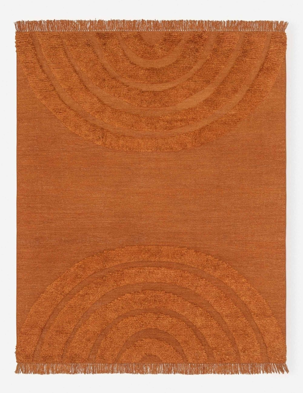 Arches Rust orange 100% wool Rug featuring a high-low pile arched design by Sarah Sherman Samuel