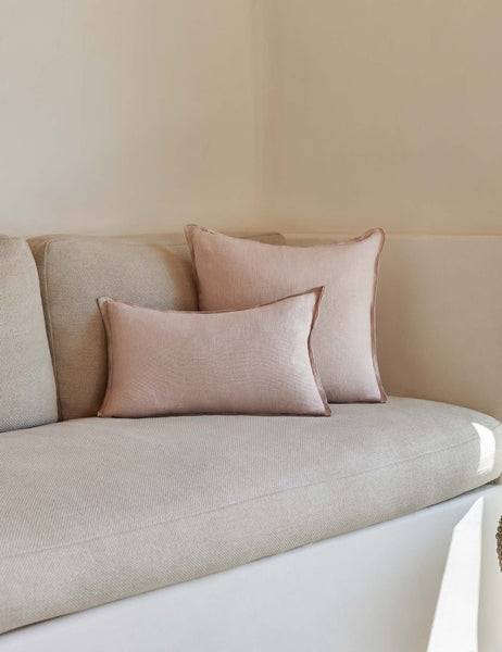 #color::greige #style::square #fill type::with-feather-down-insert #fill type::pillow-cover-only | The arlo Greige flax linen pillow in its lumber and square sizes sit together on a natural linen sofa