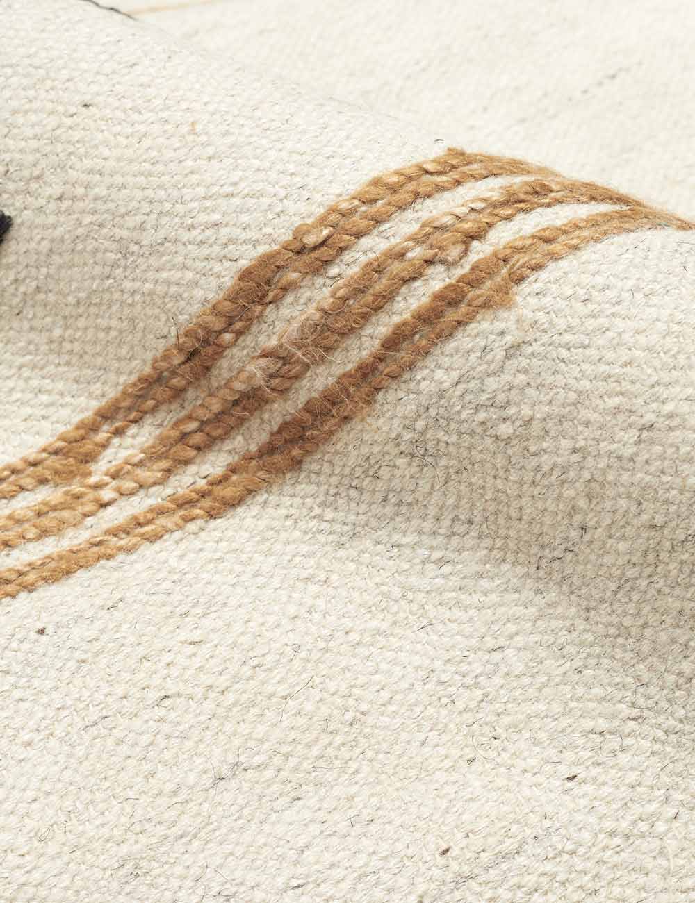 Close-up of the thin orange stripes on the Iconic Stripe Rug