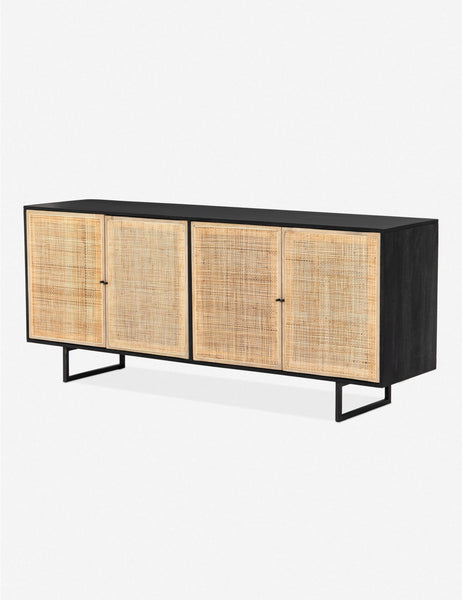 #color::black-and-natural | Angled view of the Hannah black mango wood sideboard with cane doors and an iron base.