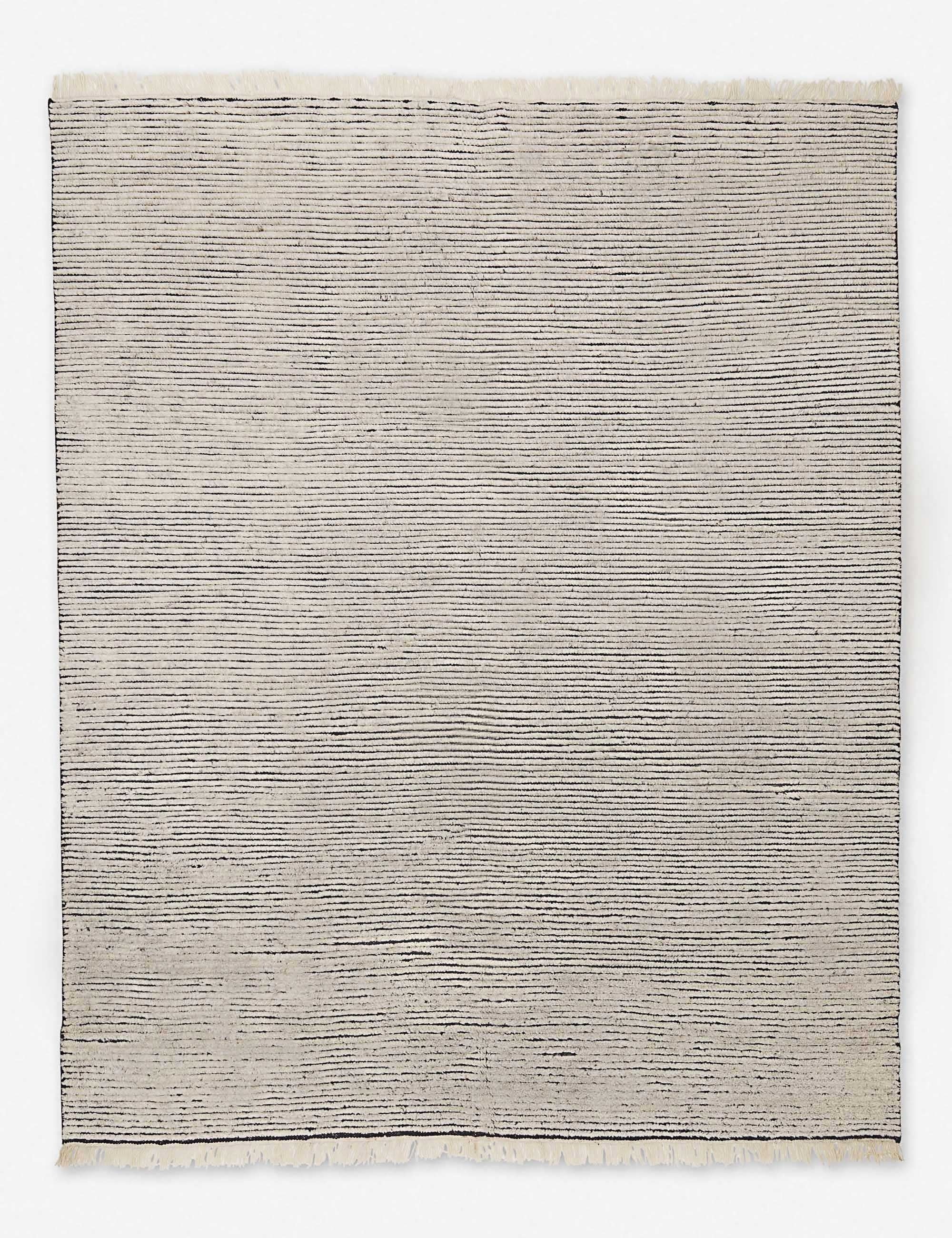 Kenzi black and natural rug with a striped texture and black accent stripes