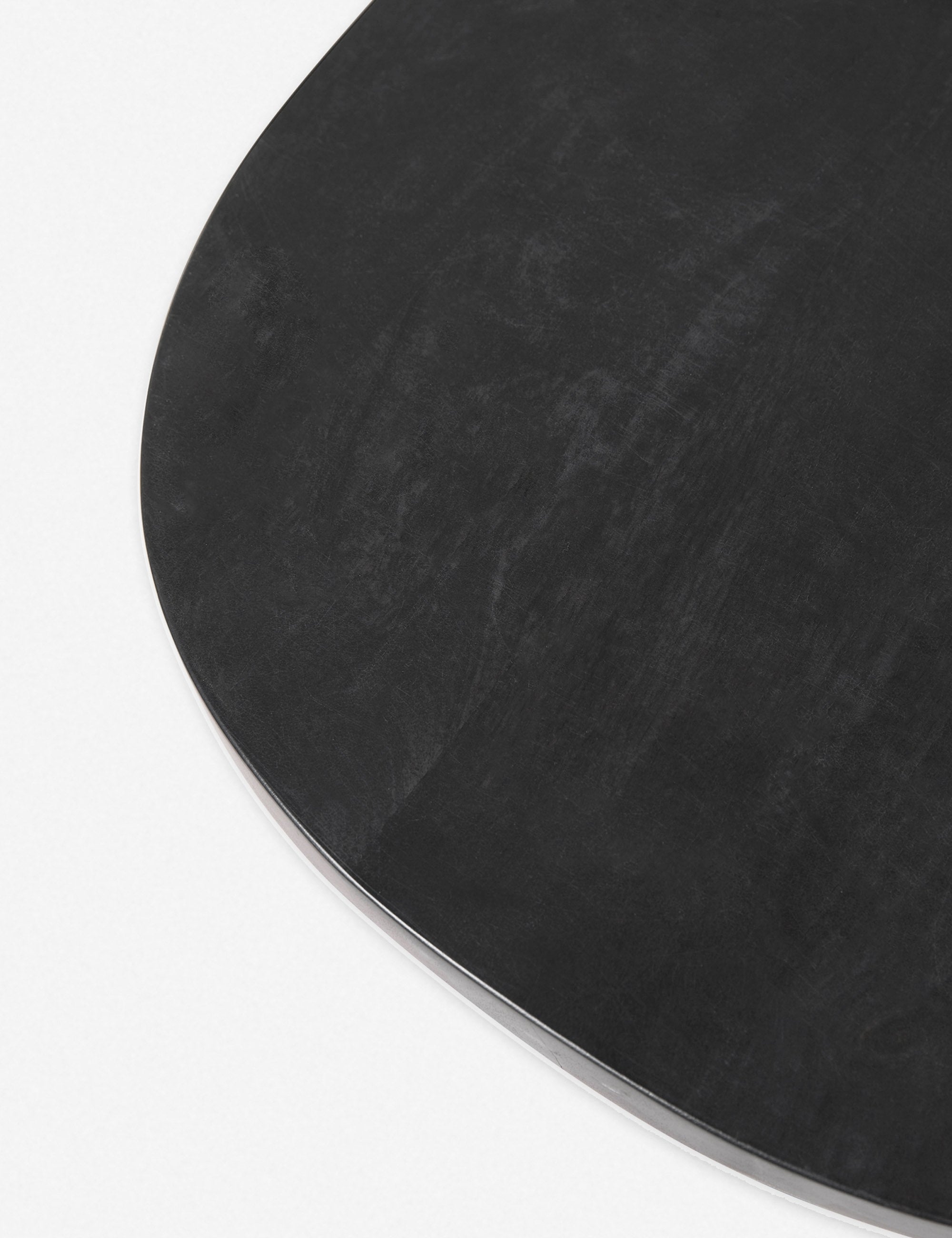 The top of the Luna black wood round side table