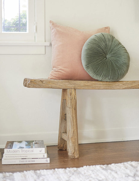 #color::rosewater #style::square  #fill type::with-feather-down-insert  #fill type::pillow-cover-only |   Charlotte rosewater pink square velvet pillow sits on a wooden bench with a light green velvet disc pillow