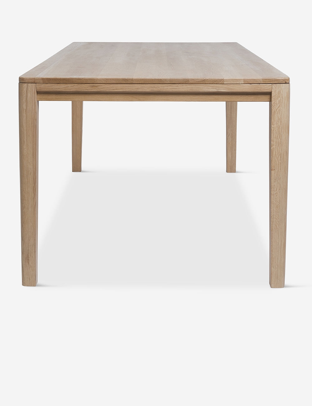 Side view of the Reese oak wood rectangular dining table.