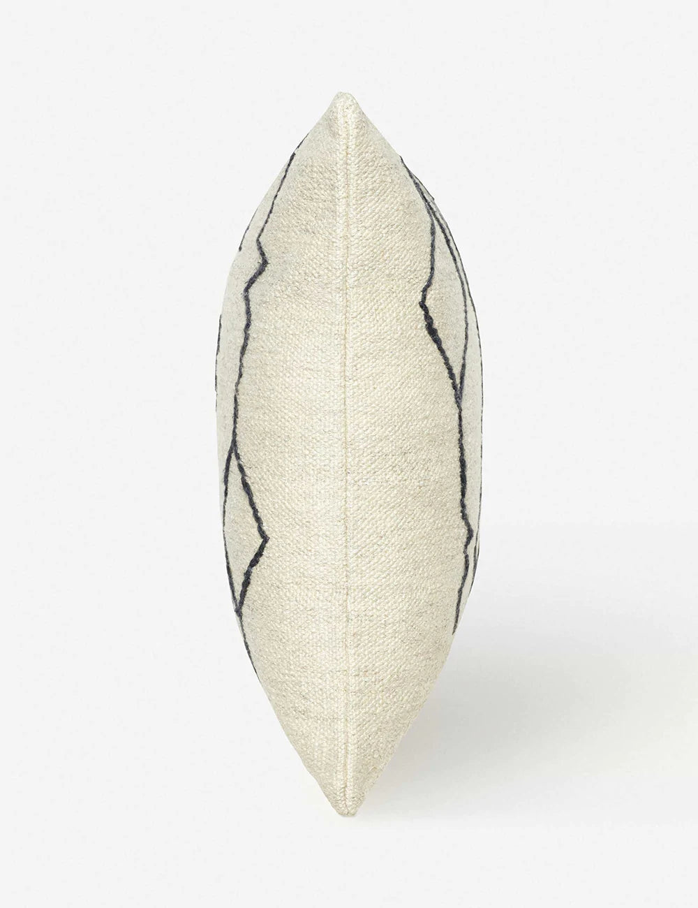 Side view of the Moroccan black and natural beni ourain inspired square flat weave pillow by Sarah Sherman Samuel