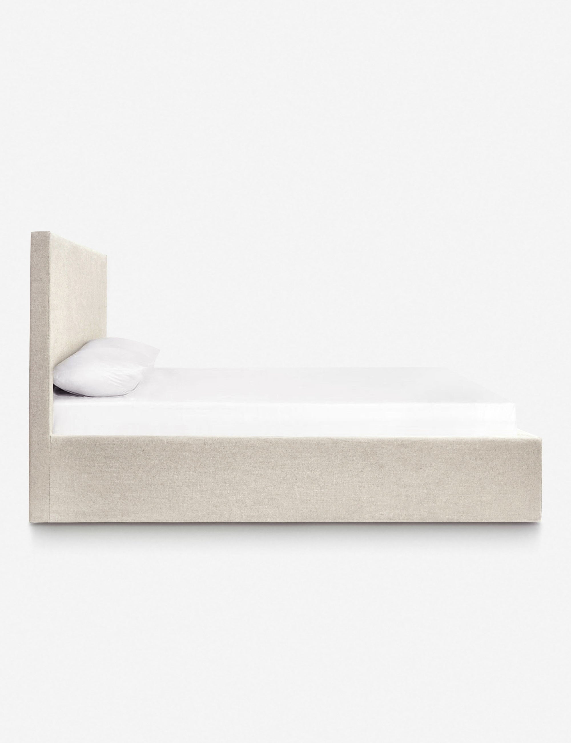 Side of the Paxton natural linen slipcover bed