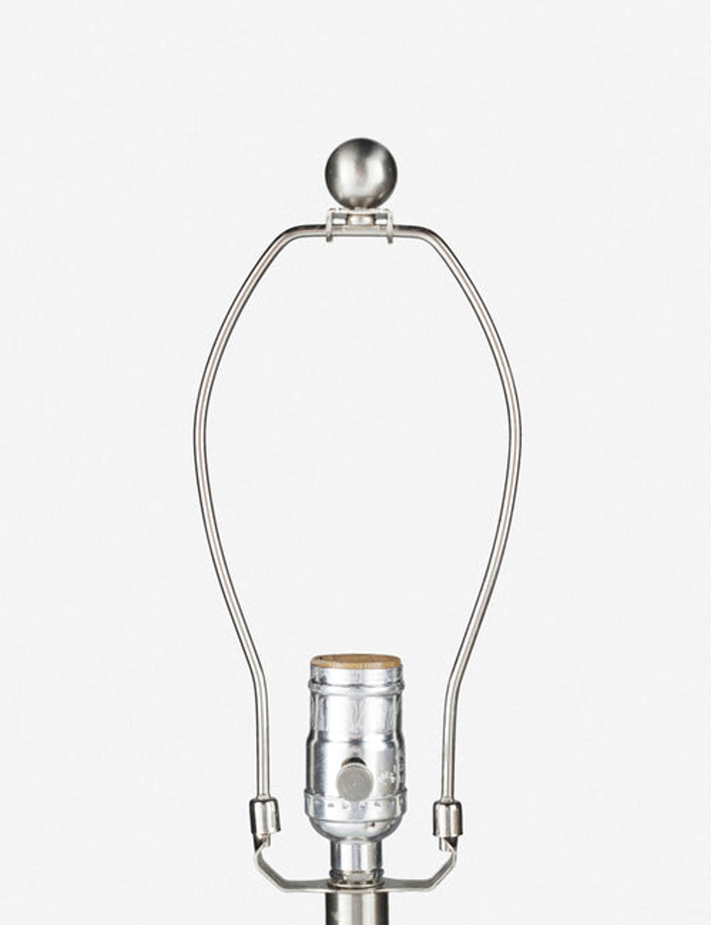 Close-up of the silver light fixture on the Vivienne tan ceramic table lamp with spherical base